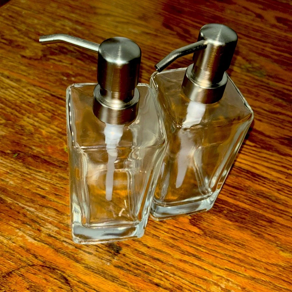 2 Glass soap and lotion dispensers